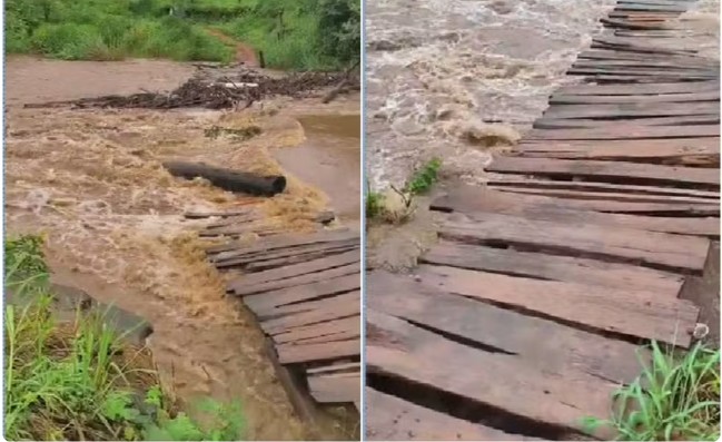 Ponte de madeira danificada por enchente.